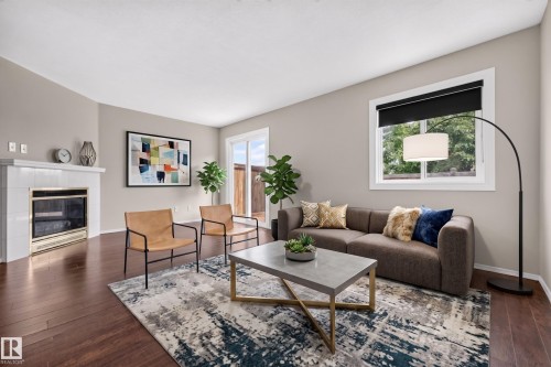 #14 14803 34 St Nw, Edmonton, AB - Indoor Photo Showing Living Room With Fireplace