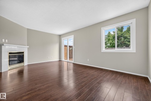 #14 14803 34 St Nw, Edmonton, AB - Indoor Photo Showing Other Room With Fireplace