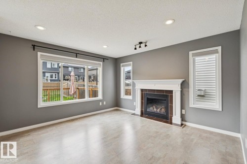 5935 18 Avenue Sw, Edmonton, AB - Indoor Photo Showing Living Room With Fireplace