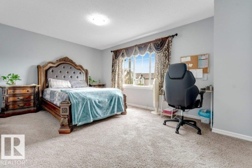 Light gray wall paint, off-white carpeting, and a flush mount ceiling light - 2436 18 Avenue Nw, Edmonton, AB 