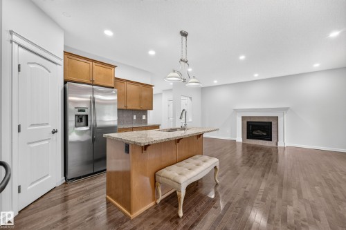 8226 180A Avenue Nw, Edmonton, AB - Indoor Photo Showing Kitchen With Fireplace