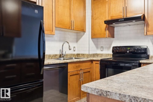 #408 9715 110 St Nw, Edmonton, AB - Indoor Photo Showing Kitchen With Double Sink