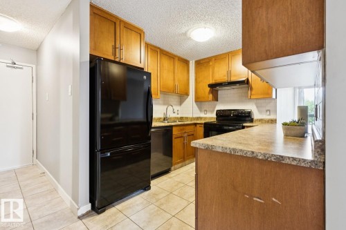 #408 9715 110 St Nw, Edmonton, AB - Indoor Photo Showing Kitchen