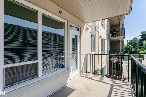 Private balcony with concrete flooring and black metal railing - #208 9907 91 Av Nw, Edmonton, AB - Outdoor With Balcony With Exterior