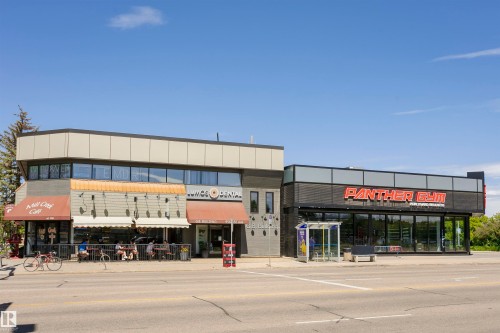 Commercial storefronts featuring large display windows and awnings - #208 9907 91 Av Nw, Edmonton, AB - Outdoor