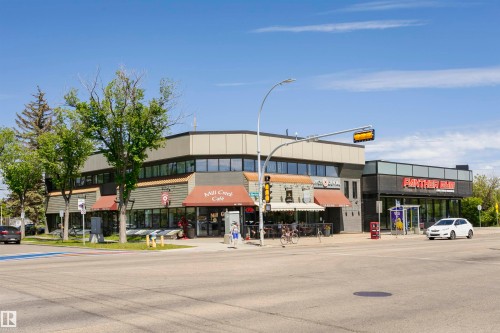 Corner commercial building featuring contemporary architecture with two distinct storefronts - #208 9907 91 Av Nw, Edmonton, AB - Outdoor