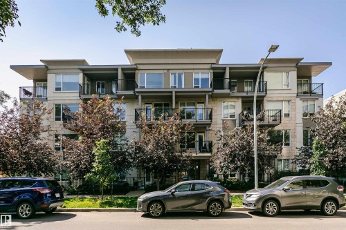 Contemporary multi-story building featuring a facade of light-toned stone and stucco - #208 9907 91 Av Nw, Edmonton, AB - Outdoor With Balcony