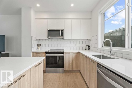 #528 857 Belmont Dr Sw, Calgary, AB - Indoor Photo Showing Kitchen With Stainless Steel Kitchen With Upgraded Kitchen