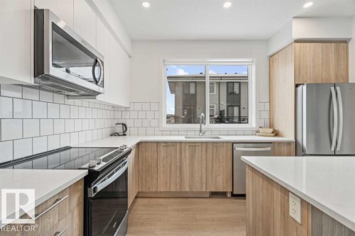 #528 857 Belmont Dr Sw, Calgary, AB - Indoor Photo Showing Kitchen With Stainless Steel Kitchen With Upgraded Kitchen
