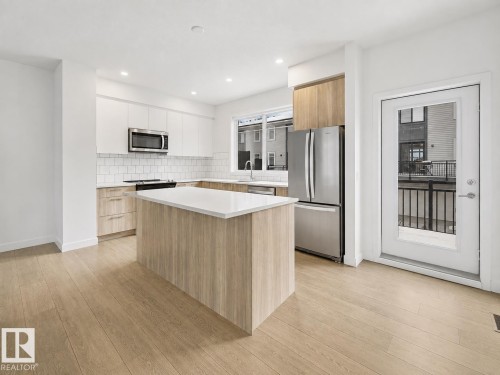 #528 857 Belmont Dr Sw, Calgary, AB - Indoor Photo Showing Kitchen With Stainless Steel Kitchen With Upgraded Kitchen