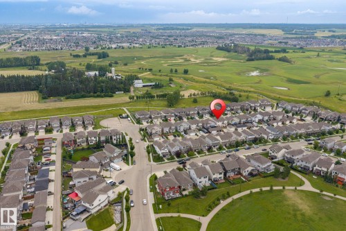 Residential neighborhood with varied architectural styles, surrounded by expansive green spaces and paved walking paths - 1209 30 Avenue Nw, Edmonton, AB - Outdoor With View