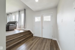 Double entry doors with upper window panels - 