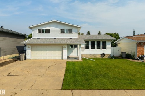 Two-story residence featuring white siding and a light gray roof - 4614 53 Ave, Calmar, AB - Outdoor