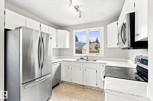 17911 77 Avenue Nw, Edmonton, AB - Indoor Photo Showing Kitchen With Double Sink