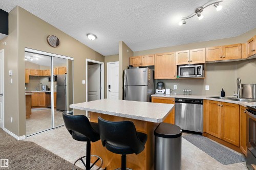 #440 1520 Hammond Gate Nw, Edmonton, AB - Indoor Photo Showing Kitchen With Stainless Steel Kitchen With Double Sink