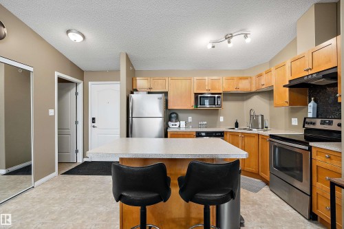 #440 1520 Hammond Gate Nw, Edmonton, AB - Indoor Photo Showing Kitchen With Stainless Steel Kitchen With Double Sink
