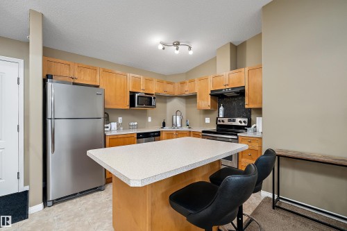 #440 1520 Hammond Gate Nw, Edmonton, AB - Indoor Photo Showing Kitchen With Stainless Steel Kitchen