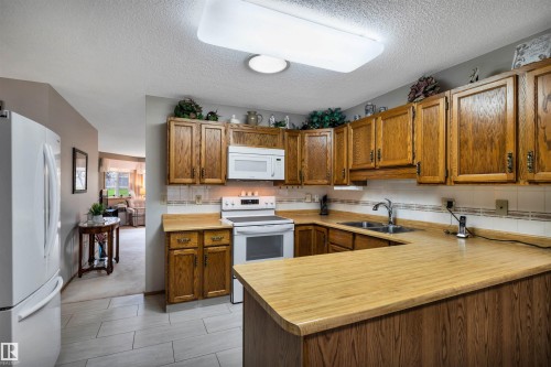 10636 153 Avenue Nw, Edmonton, AB - Indoor Photo Showing Kitchen With Double Sink