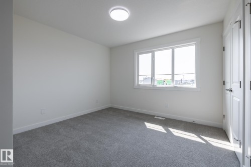 #25 7020 Keswick Cm Sw, Edmonton, AB - Indoor Photo Showing Other Room