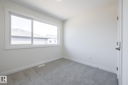 #25 7020 Keswick Cm Sw, Edmonton, AB - Indoor Photo Showing Other Room