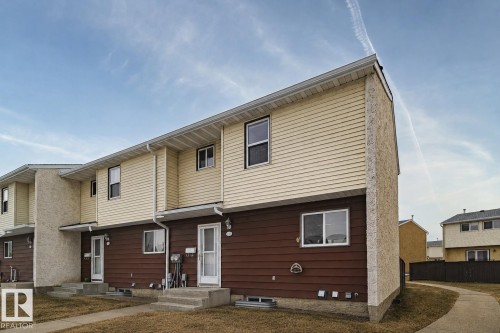 Two-story exterior with horizontal siding and stucco accents - 221 Harrison Dr Nw, Edmonton, AB - Outdoor With Exterior