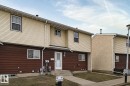 Two-story exterior with horizontal siding, covered entry, and concrete walkway - 221 Harrison Dr Nw, Edmonton, AB  - Outdoor With Exterior 