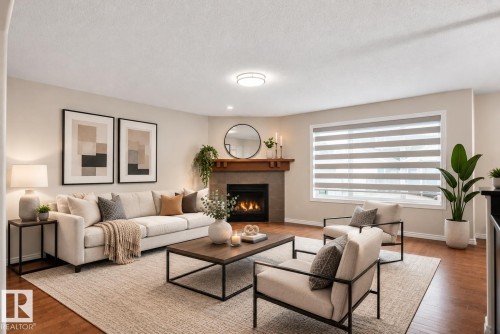 Wood-finish flooring, recessed lighting, and a corner fireplace with a wood mantle - 8432 18 Avenue Sw, Edmonton, AB - Indoor Photo Showing Living Room With Fireplace
