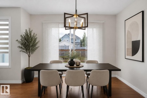 Wood-finish flooring throughout - 8432 18 Avenue Sw, Edmonton, AB - Indoor Photo Showing Dining Room