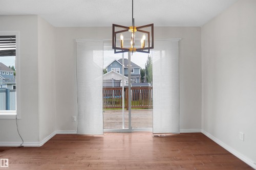 Hardwood-style flooring throughout - 8432 18 Avenue Sw, Edmonton, AB - Indoor Photo Showing Other Room