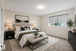 Recessed ceiling lighting, a window with horizontal blinds, and neutral carpet flooring - 