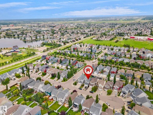 Aerial perspective of a residential neighborhood with a prominent lake - 8432 18 Avenue Sw, Edmonton, AB - Outdoor With View