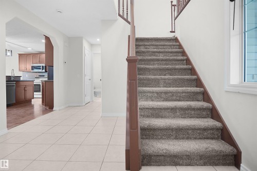 Welcoming foyer with ceramic tile flooring and open layout - 8432 18 Avenue Sw, Edmonton, AB - Indoor Photo Showing Other Room