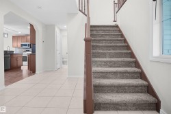Welcoming foyer with ceramic tile flooring and open layout - 
