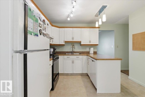 128 Green Ash Drive, Wetaskiwin, AB - Indoor Photo Showing Kitchen With Double Sink
