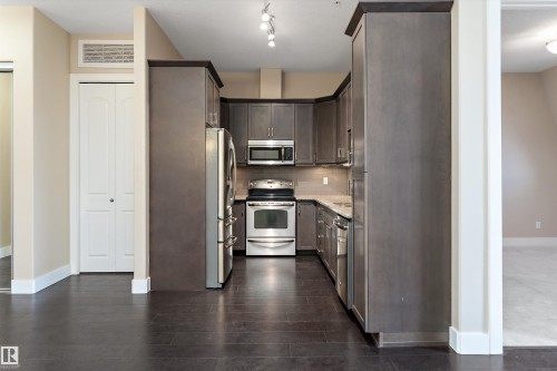 #449 6079 Maynard Wy Nw, Edmonton, AB - Indoor Photo Showing Kitchen With Upgraded Kitchen