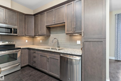 #449 6079 Maynard Wy Nw, Edmonton, AB - Indoor Photo Showing Kitchen With Double Sink With Upgraded Kitchen