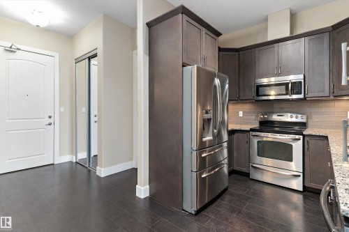 #449 6079 Maynard Wy Nw, Edmonton, AB - Indoor Photo Showing Kitchen