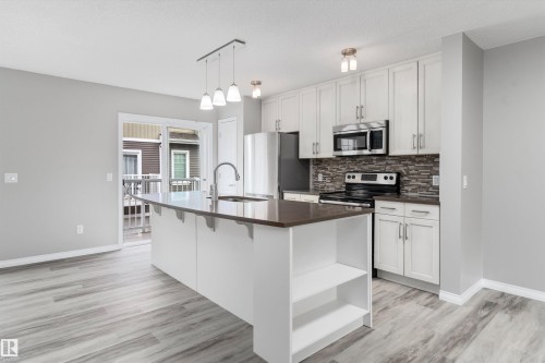 #98 4050 Savaryn Dr Sw, Edmonton, AB - Indoor Photo Showing Kitchen With Upgraded Kitchen