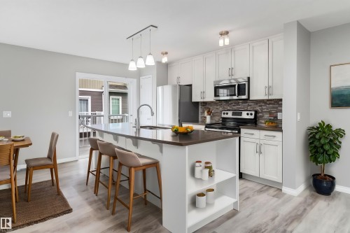 #98 4050 Savaryn Dr Sw, Edmonton, AB - Indoor Photo Showing Kitchen With Upgraded Kitchen