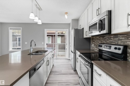 #98 4050 Savaryn Dr Sw, Edmonton, AB - Indoor Photo Showing Kitchen With Double Sink With Upgraded Kitchen