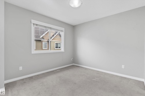 #98 4050 Savaryn Dr Sw, Edmonton, AB - Indoor Photo Showing Other Room