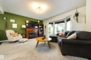 4233 85 Street Nw, Edmonton, AB  - Indoor Photo Showing Living Room With Fireplace 