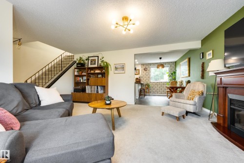 4233 85 Street Nw, Edmonton, AB - Indoor Photo Showing Living Room With Fireplace