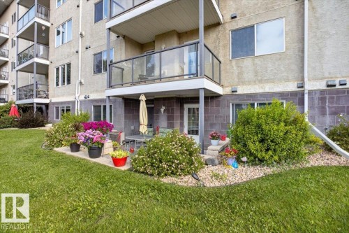 Private patio area featuring a concrete surface and direct outdoor access - #116 237 Youville Dr E Nw, Edmonton, AB - Outdoor