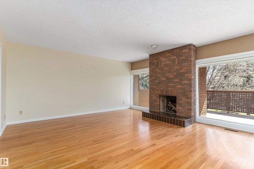 #7 14824 45 Av Nw, Edmonton, AB - Indoor Photo Showing Living Room With Fireplace