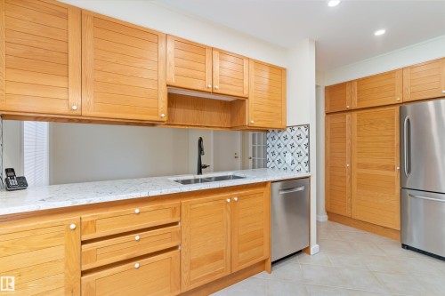 #7 14824 45 Av Nw, Edmonton, AB - Indoor Photo Showing Kitchen With Stainless Steel Kitchen With Double Sink