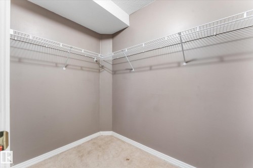 Wall-to-wall wire shelving, corner configuration, and carpeted flooring - 8 Osborne Close, St. Albert, AB - Indoor With Storage
