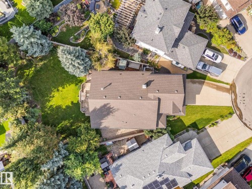 Expansive property with a brown shingle roof, green lawn, and mature trees - 8 Osborne Close, St. Albert, AB - Outdoor With View