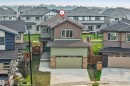 Contemporary two-story residence featuring multi-tone siding and stone accents - 329 Balsam Link, Leduc, AB  - Outdoor With Facade 