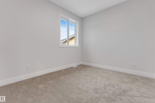 Neutral wall tones paired with soft grey carpeting create a serene atmosphere - 329 Balsam Link, Leduc, AB - Indoor Photo Showing Other Room